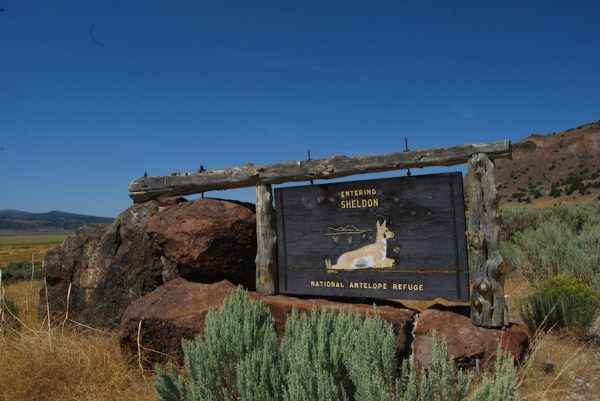 A historic sign at the entrance of the Sheldon National Wildlife Refuge