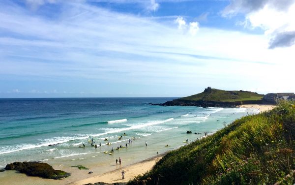 St. Ives's surf school on a summer Saturday morning at Porthmeor Beach, St. Ives, Cornwall