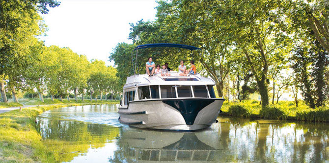 Rent boat to see canals in France and Netherlands