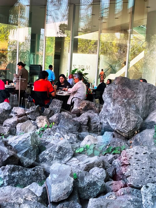 Nube Siete restaurant with volcanic rocks underneath