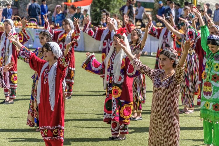 The Tajik girls in national outfits are dancing on Tajikistan Independence Day